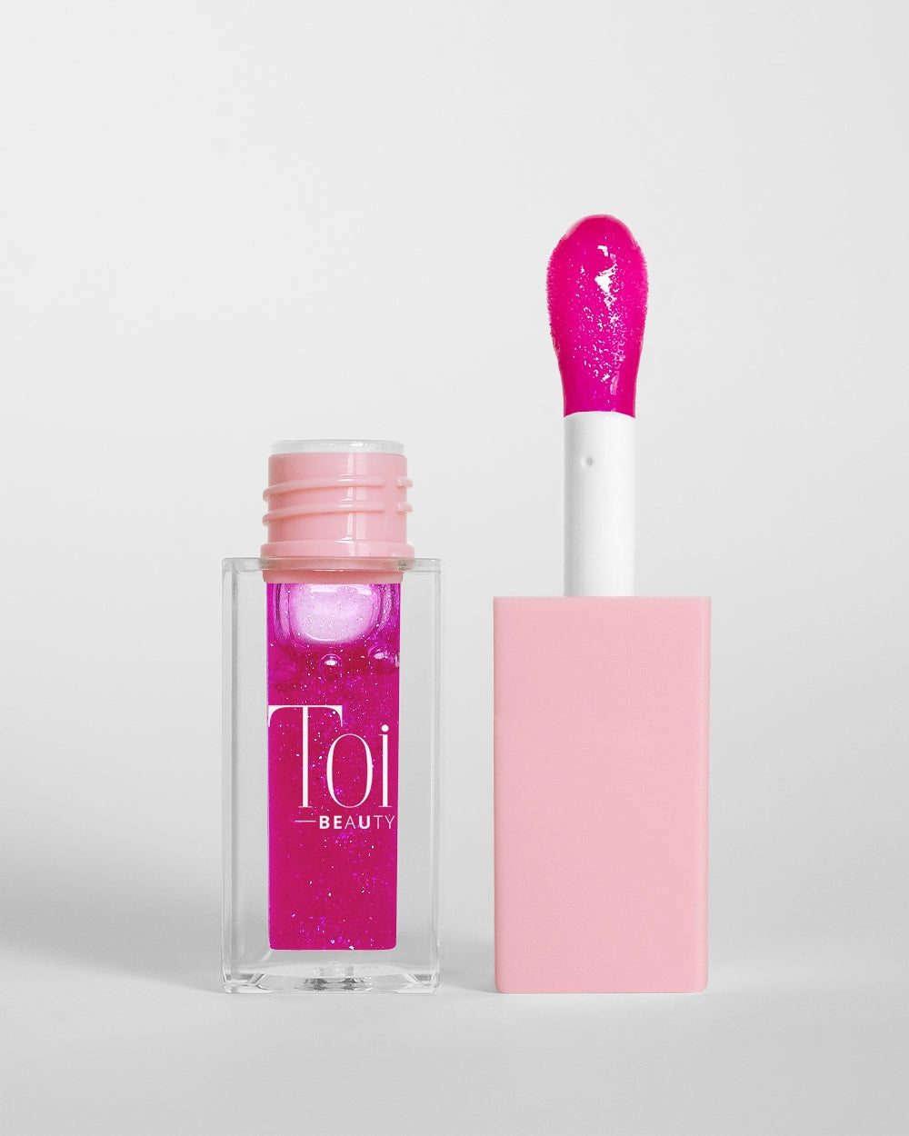 Tinted lip oil in clear packaging for everyday wear. Color Alchemy