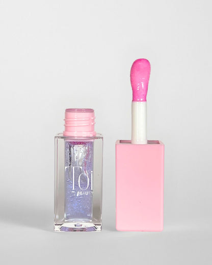 Tinted lip oil in clear packaging for everyday wear. Color Magic