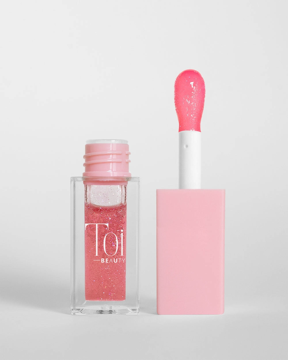 Tinted lip oil in clear packaging for everyday wear. Color Peach